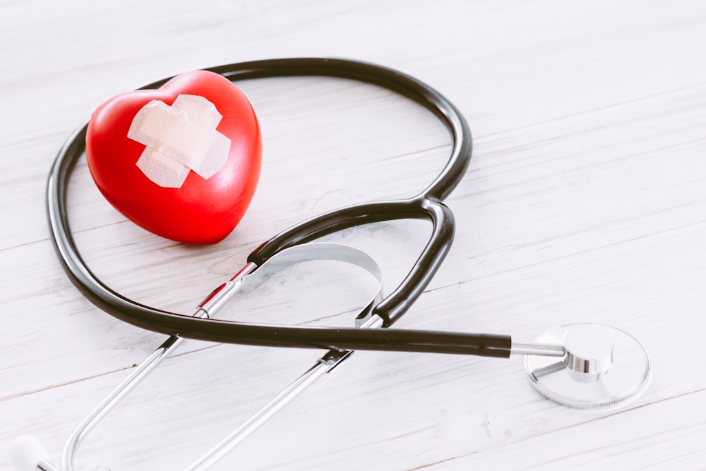 high-angle-view-stethoscope-with-heart-shape-wooden-table.jpg